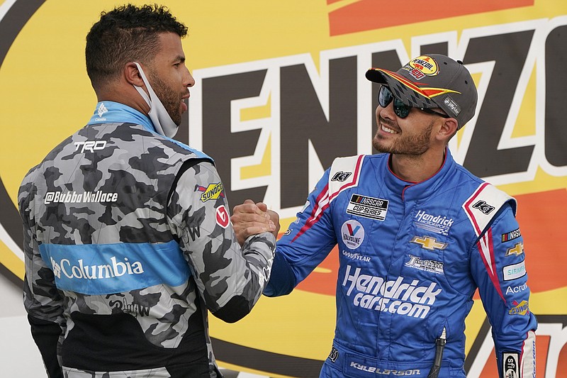 AP photo by John Locher / Bubba Wallace, left, congratulates Kyle Larson for winning Sunday's NASCAR Cup Series race in Las Vegas.