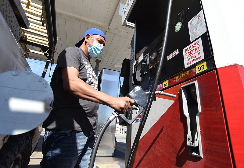 Staff Photo by Matt Hamilton / Chattanooga resident Rogilio Trujillo purchases gas at the Kanku's Gas Station on Shallowford Road in Chattanooga on Monday March 8, 2021.
