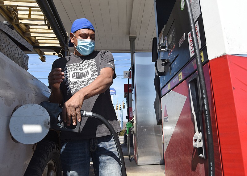 Staff Photo by Matt Hamilton / Chattanooga resident Rogilio Trujillo purchases gas at the Kanku's Gas Station on Shallowford Road in Chattanooga on Monday March 8, 2021.