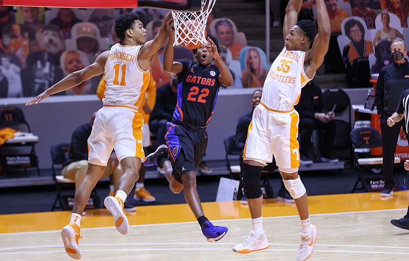 USA Today photo by Randy Sartin / Tennessee freshman guard Jaden Springer and senior forward Yves Pons defend Florida junior guard Tyree Appleby during Sunday afternoon's 65-54 win by the Volunteers.