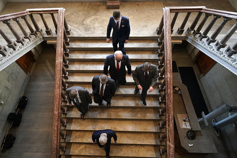 Legislators leave the floor of the State Capitol that contains the House and Senate chambers after adjourning on the first day of the legislative session Tuesday, Jan. 12, 2021, in Nashville, Tenn. (AP Photo/Mark Humphrey)