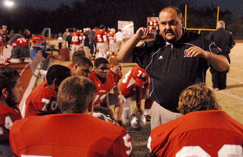 Staff photo by Robin Rudd/Chattanooga Times Free Press -- Nov 2, 2012--Ooltewah head coach Shannon Williams instructs his offensive lineman between series.  The Anderson County Mavericks visited Ooltewah in the first round of the TSSAA State Football Playoffs.