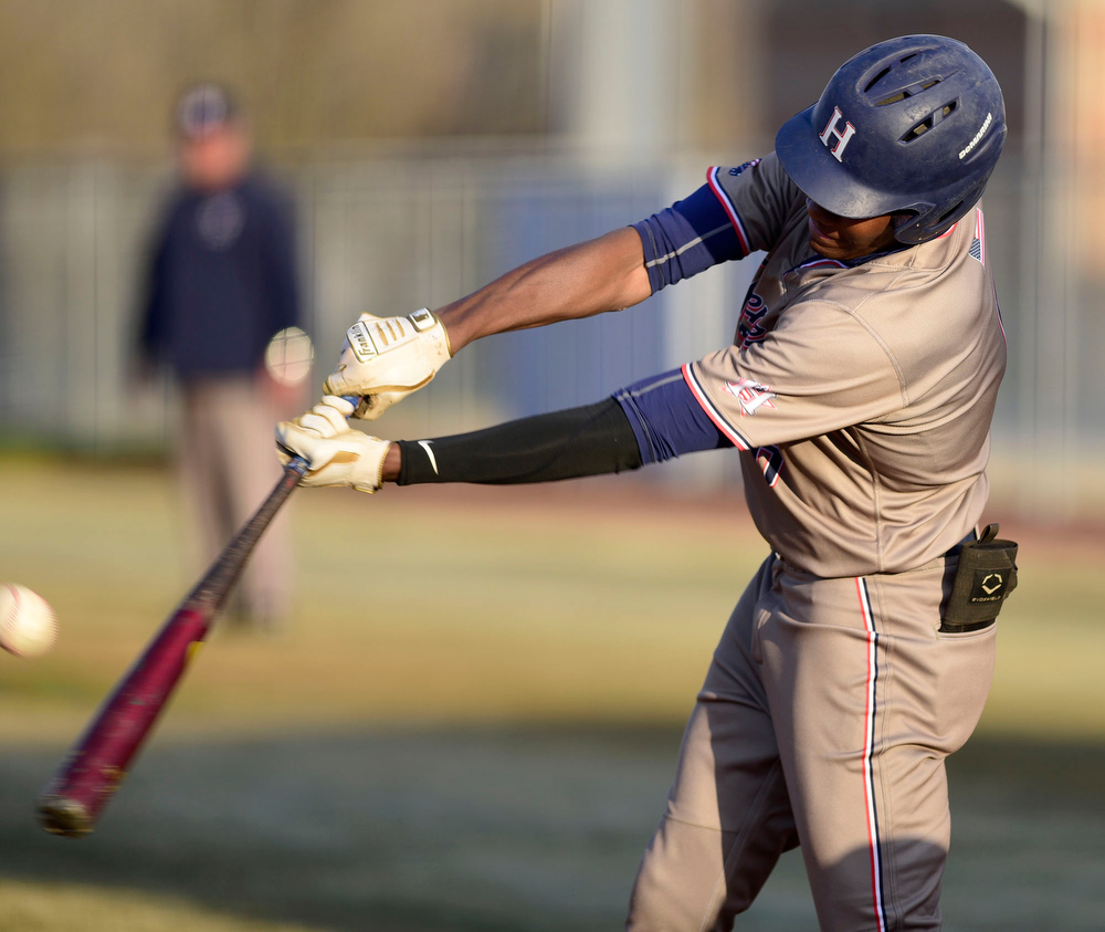Staff Photo by Robin Rudd / Heritage's CJ Robertson (6) makes contact with the ball. The Heritage Generals hosted the Southeast Whitfield Raiders in GHSA basely on March 9, 2021.