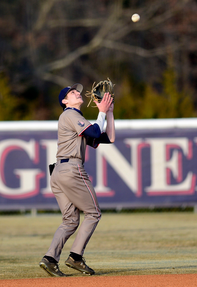 Staff Photo by Robin Rudd / Heritage shortstop Caden Snyder (3) catches a short pop fly. The Heritage Generals hosted the Southeast Whitfield Raiders in GHSA basely on March 9, 2021.