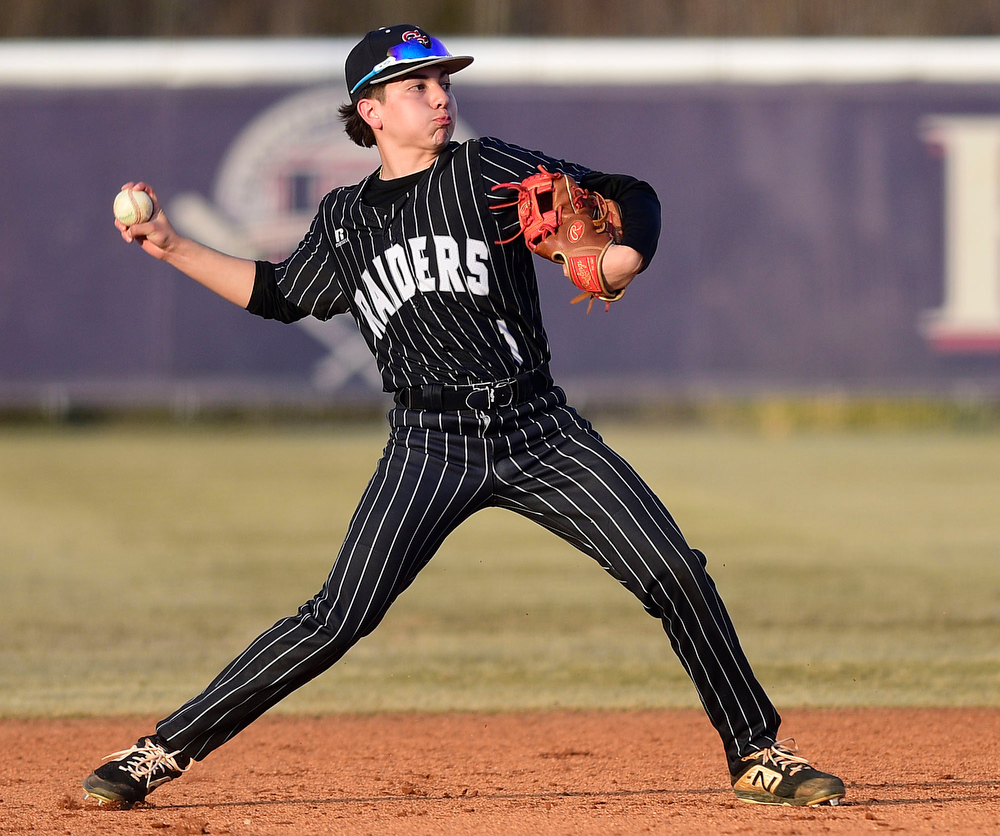 Staff Photo by Robin Rudd / Southeast shortstop Johnny Vega (1) throws to first. The Heritage Generals hosted the Southeast Whitfield Raiders in GHSA basely on March 9, 2021.