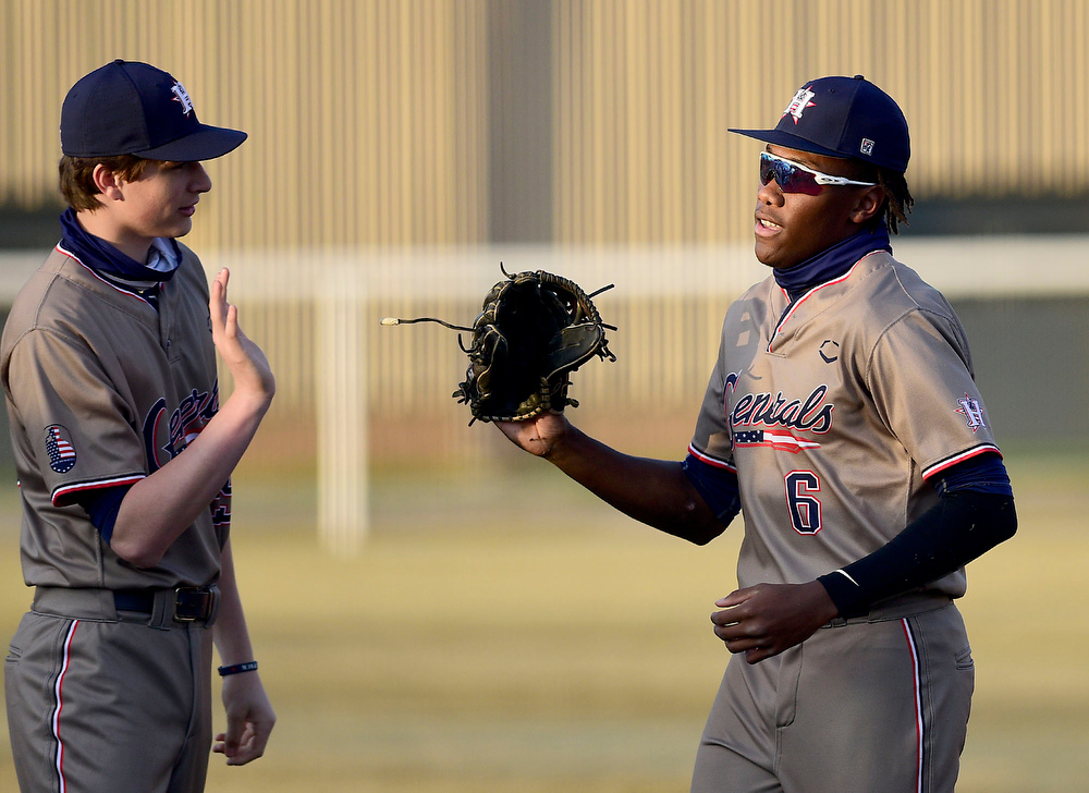 Staff Photo by Robin Rudd / Heritage right fielder CJ Robertson (6) is congratulated after making a diving catch to end the inning. The Heritage Generals hosted the Southeast Whitfield Raiders in GHSA basely on March 9, 2021.