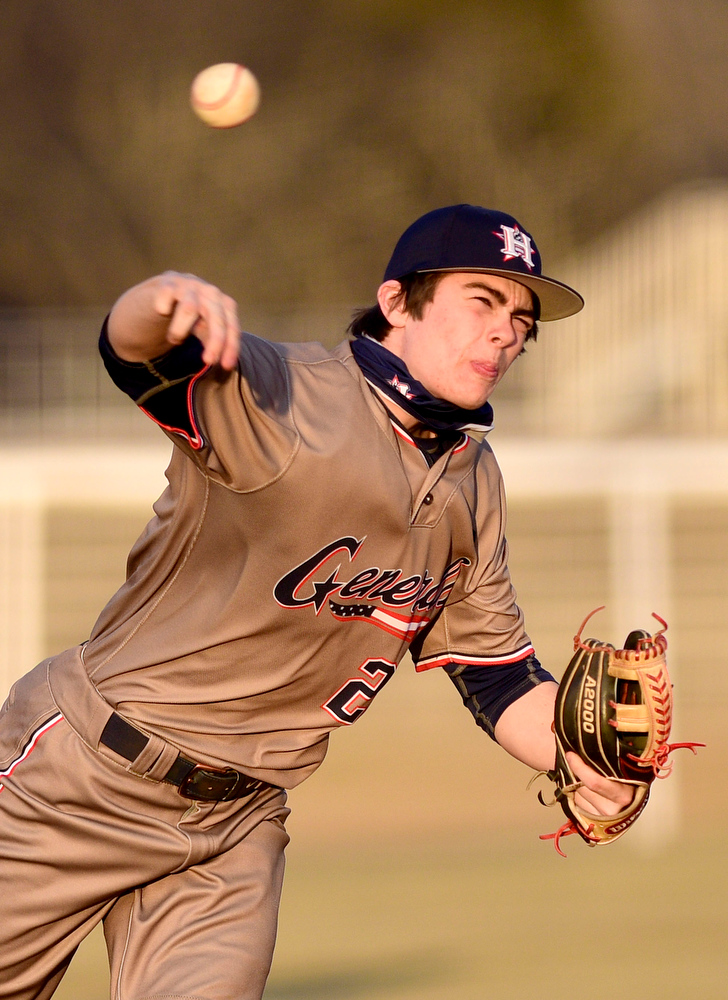 Staff Photo by Robin Rudd / Heritage pitcher, Zach Barrett (21) throws to the plate. The Heritage Generals hosted the Southeast Whitfield Raiders in GHSA basely on March 9, 2021.