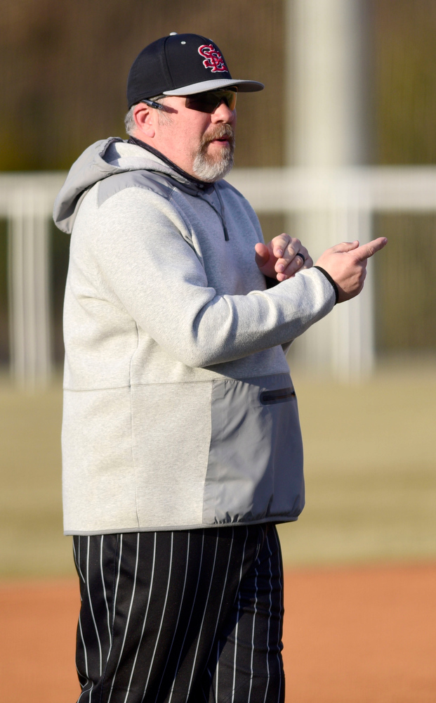 Staff Photo by Robin Rudd / Southeast head coach Brad Lofton directs a batter. The Heritage Generals hosted the Southeast Whitfield Raiders in GHSA basely on March 9, 2021.