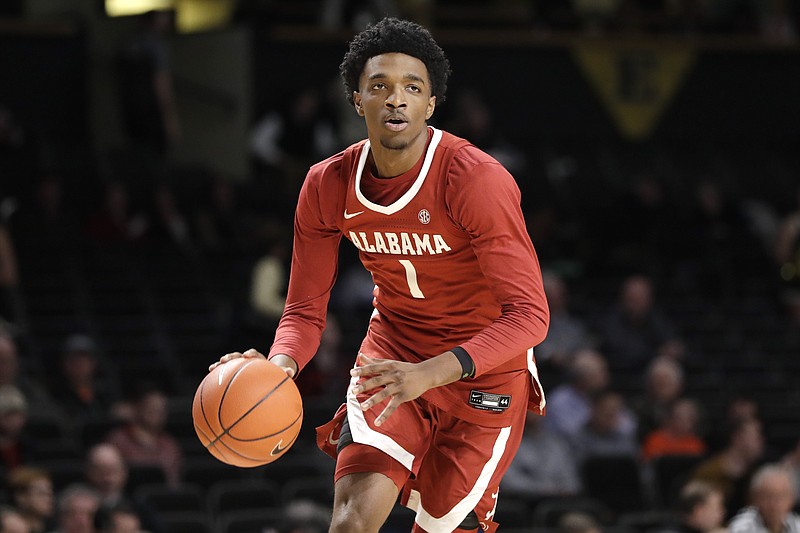 FILE - In this Jan. 22, 2020, file photo, Alabama forward Herbert Jones plays against Vanderbilt in the first half of an NCAA college basketball game in Nashville, Tenn. Alabama senior Herbert Jones is The Associated Press player of the year in the Southeastern Conference and a member of the All-SEC first team in voting announced Tuesday, March 9, 2021. (AP Photo/Mark Humphrey, File)