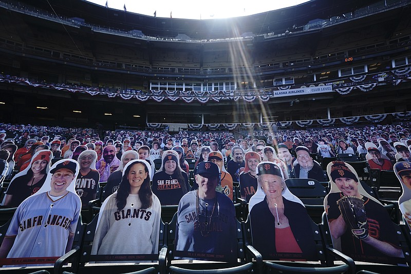 AP photo by Jeff Chiu / Cardboard cutouts of fans fill seats at Oracle Park before a game between the San Diego Padres and the host San Francisco Giants last July 28.