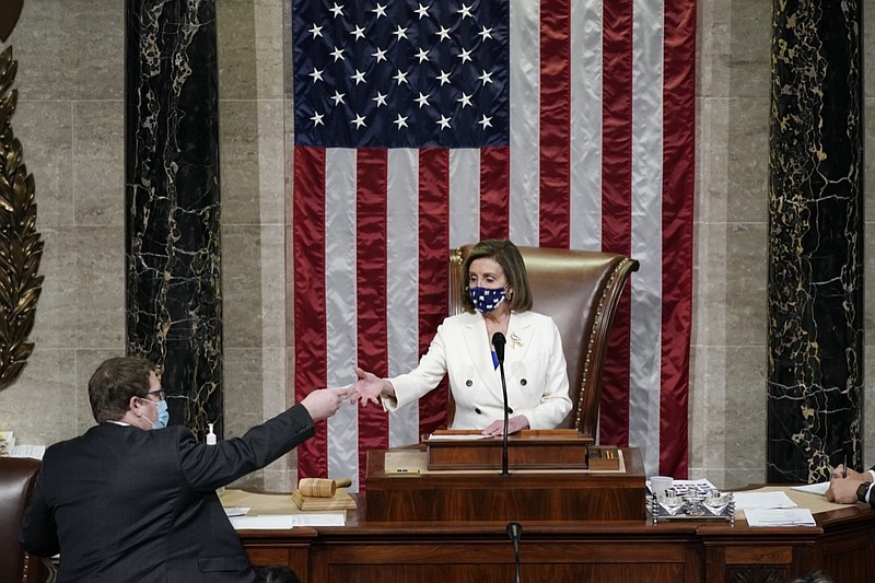 Speaker of the House Nancy Pelosi, D-Calif., leads the vote to approve a landmark $1.9 trillion COVID-19 relief bill, at the Capitol in Washington, Wednesday, March 10, 2021. (AP Photo/J. Scott Applewhite)
