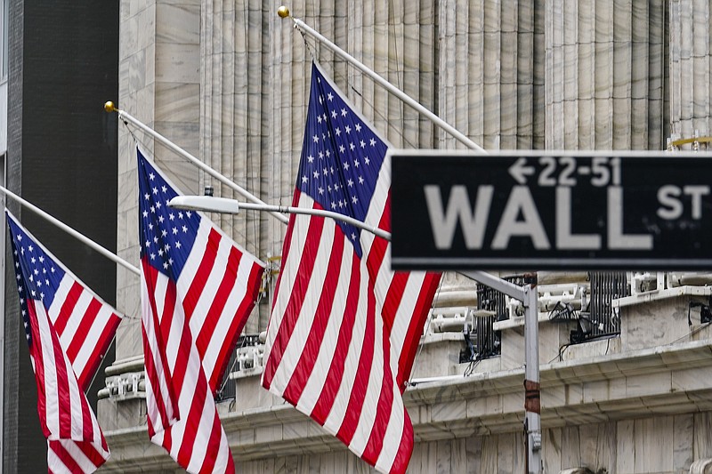 FILE - American flags hang outside of the New York Stock Exchange, in this Tuesday, Feb. 16, 2021, file photo. Stocks are starting higher on Wall Street with an assist from technology companies, which have seen big swings in recent days. The S&P 500 index was up 0.7% in the early going Thursday, March 11, while the tech-heavy Nasdaq was up 1.7%. (AP Photo/Frank Franklin II, File)