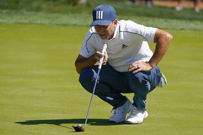 AP photo by John Raoux / Sergio Garcia lines up a putt on the fifth hole at TPC Sawgrass during the first round of the The Players Championship on Thursday in Ponte Vedra Beach, Fla. Garcia shot a 65 and had a two-shot lead over Brian Harman.