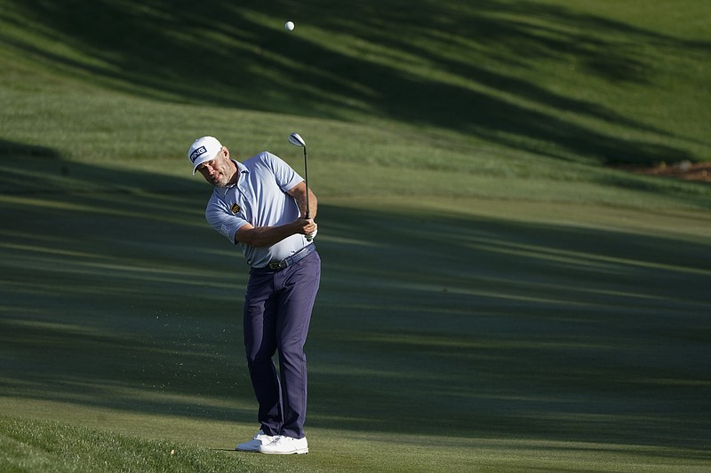 AP photo by Gerald Herbert / Lee Westwood chips to the ninth green of the Stadium Course at TPC Sawgrass during the second round of The Players Championship on Friday in Ponte Vedra Beach, Fla.