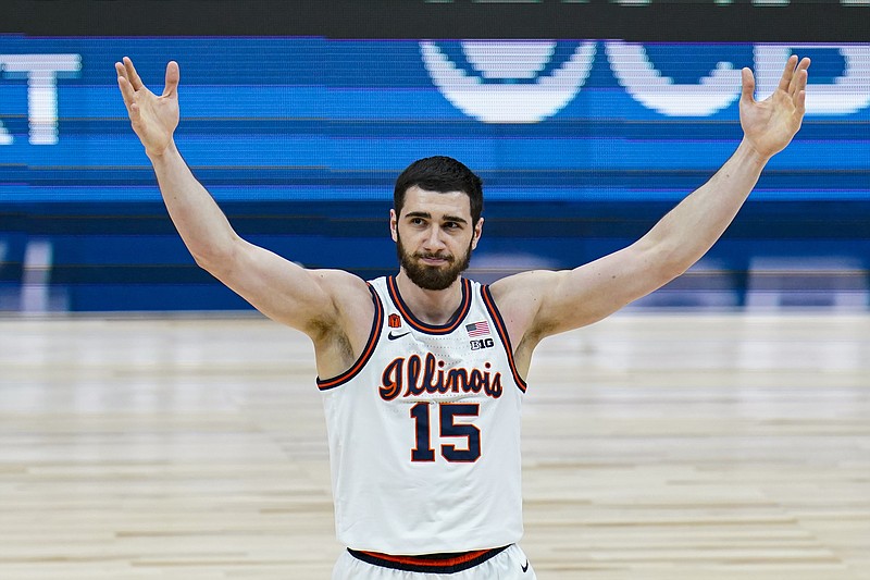 AP photo by Michael Conroy / Illinois forward Giorgi Bezhanishvili celebrates during the Big Ten men's basketball tournament title game against Ohio State on Sunday in Indianapolis. The Fighting Illini won 91-88 in overtime in the same city around which the entire 68-team NCAA tournament will be based when it tips off later this week.