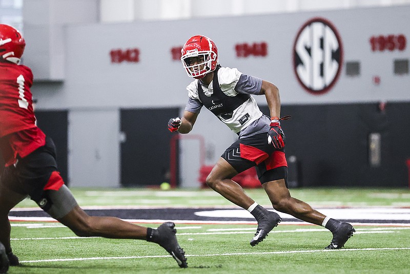 Georgia photo by Tony Walsh / Georgia junior defensive back Lewis Cine chases receiver George Pickens during Tuesday's first spring practice in Athens. Cine does not view the defenders as underdogs despite all the familiar faces returning on the Bulldogs offense.