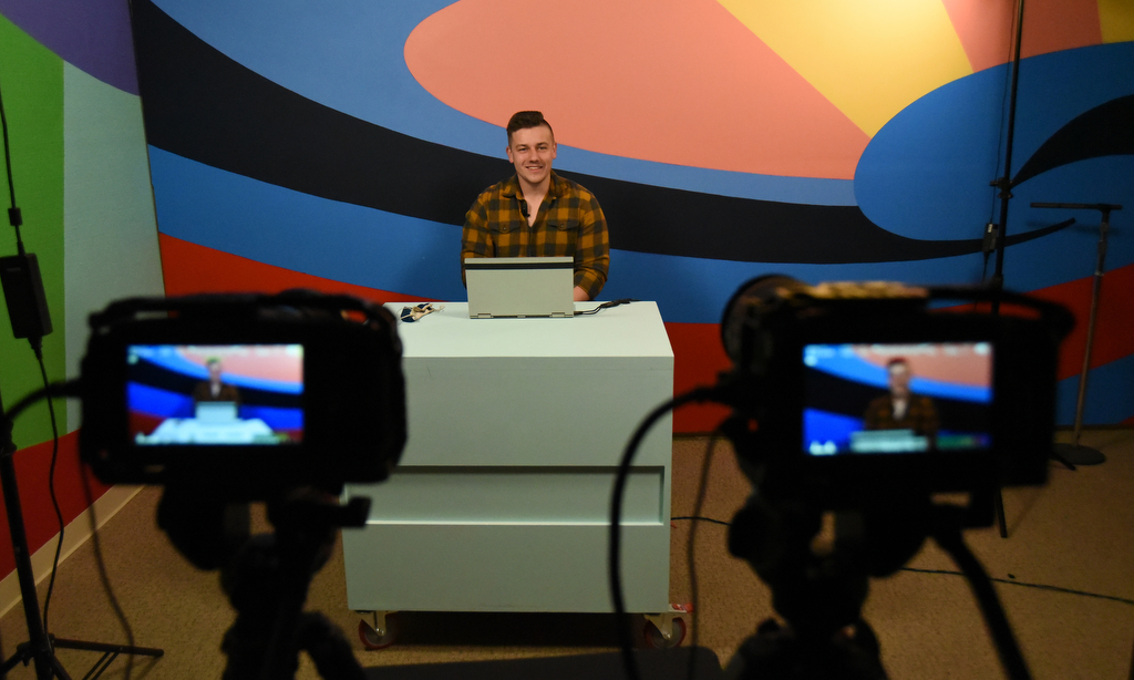 Staff Photo by Matt Hamilton / UTC student Jonathan McKenzie talks about his educational lesson before recording at WTCI in Chattanooga on Wednesday, March 17, 2021.