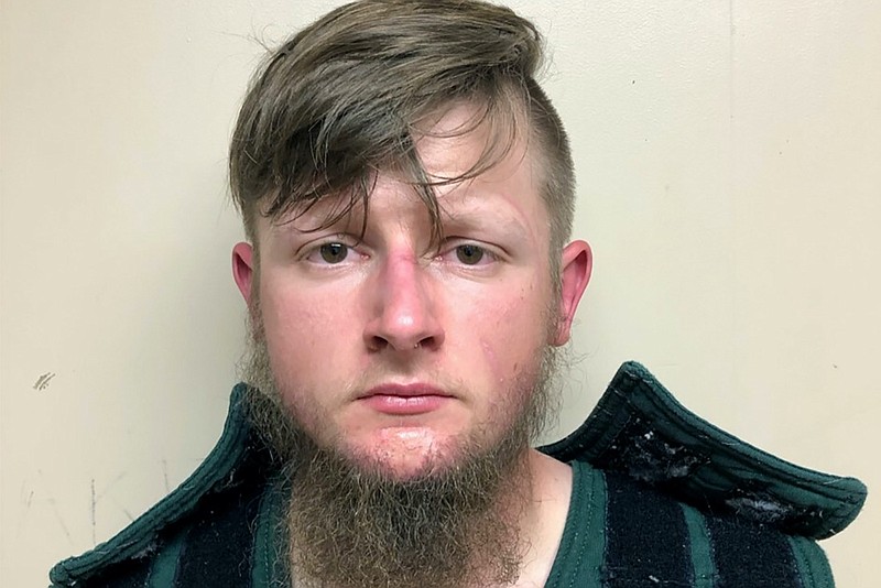 This booking photo provided by the Crisp County Sheriff's Office shows Robert Aaron Long on Tuesday, March 16, 2021. Long was arrested as a suspect in the fatal shootings of multiple people at three Atlanta-area massage parlors, most of them women of Asian descent, authorities said. (Crisp County Sheriff's Office via AP)