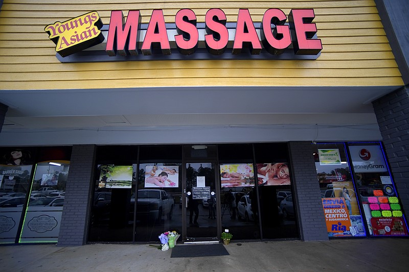 A make-shift memorial is seen outside a business where a multiple fatal shooting occurred on Tuesday, Wednesday, March 17, 2021, in Acworth, Ga. Robert Aaron Long, a white man, is accused of killing several people, most of whom were of Asian descent, at massage parlors in the Atlanta area. (AP Photo/Mike Stewart)
