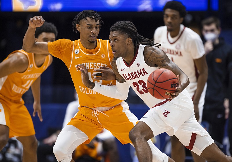 Southeastern Conference photo / Tennessee freshman Keon Johnson guards Alabama senior John Petty during last Saturday's SEC tournament semifinal game won by the Crimson Tide 73-68. Volunteers coach Rick Barnes expects his team to carry the high-level performances in Nashville last weekend into Friday's NCAA first-round matchup against Oregon State in Indianapolis.