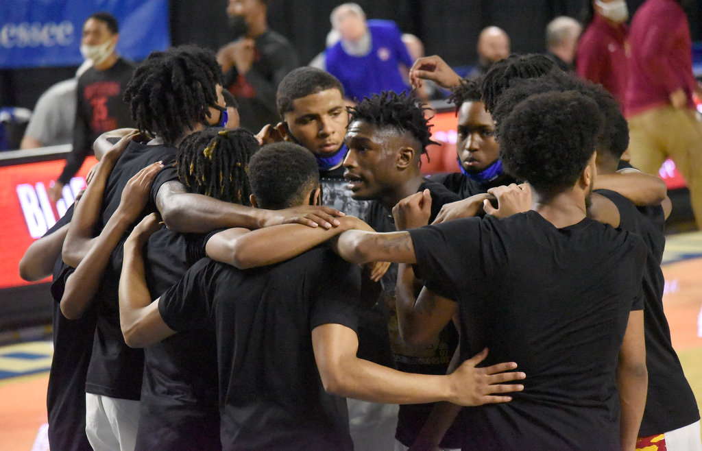 Staff Photo by Matt Hamilton / Howard players huddle before the start of their playoff game at the Murphy Center in Murfreesboro on Thursday, March 18, 2021.
