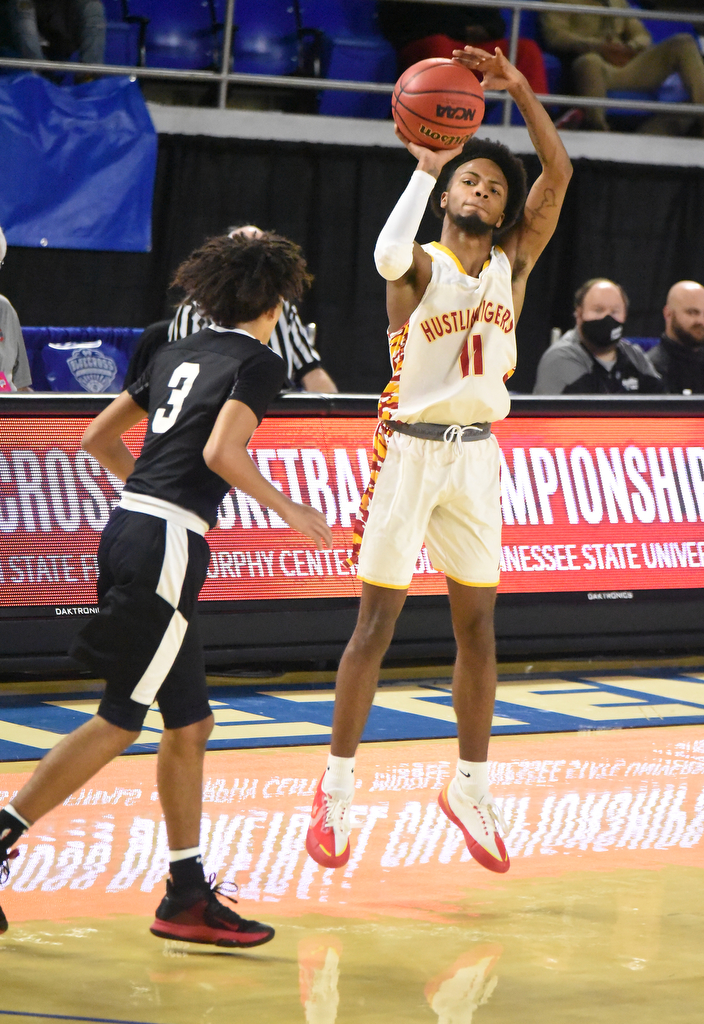 Staff Photo by Matt Hamilton / Howard's (11) Xavier Fisher puts up a long three as Jackson South Side's (3) Micheal Ward defends at the Murphy Center in Murfreesboro on Thursday, March 18, 2021.