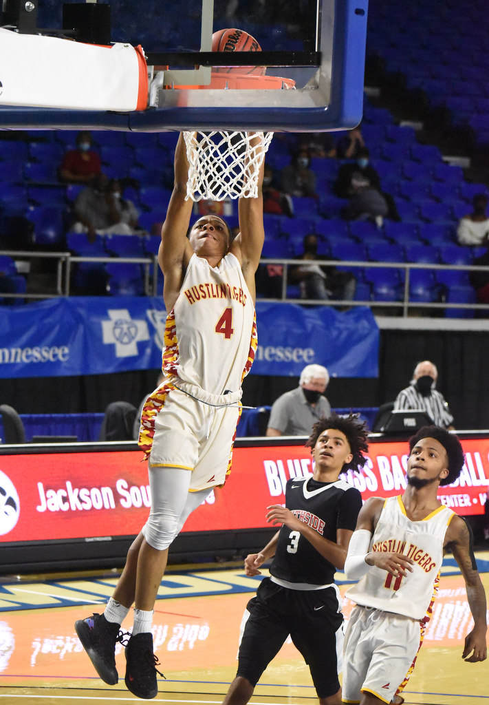Staff Photo by Matt Hamilton / Howard's (4) Jadon Jenkins scores a slam dunk on a breakaway at the Murphy Center in Murfreesboro on Thursday, March 18, 2021.