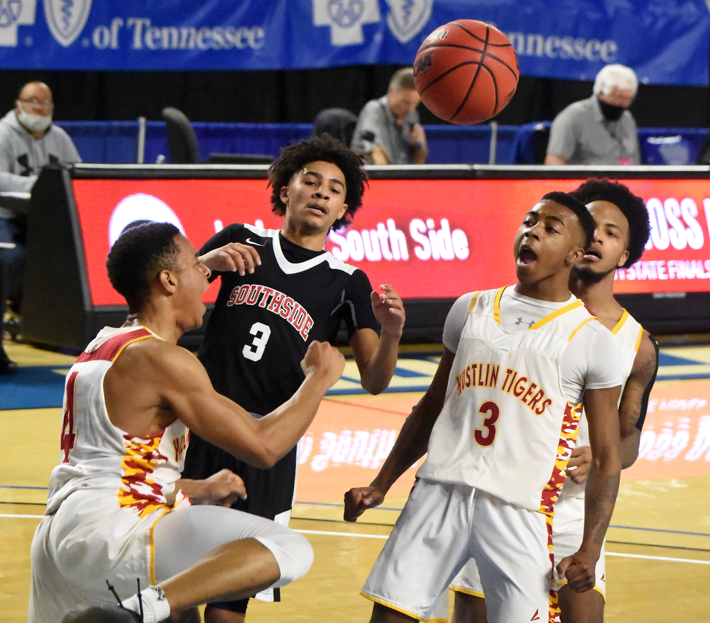 Staff Photo by Matt Hamilton / Howard (4) Jadon Jenkins and (3) Jacobi Dixon celebrate after a dunk at the Murphy Center in Murfreesboro on Thursday, March 18, 2021.
