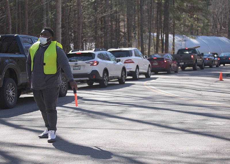 Staff photo by Troy Stolt / Hamilton County health department worker Gerry Davis directs traffic at the Health Departmentճ Enterprise South COVID Vaccination POD on Wednesday, March 3, 2021, in Chattanooga, Tenn.