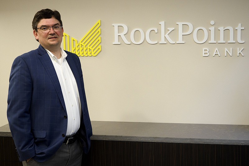 Staff photo by C.B. Schmelter / President and CEO Hamp Johnston poses at RockPoint Bank, which will open in the 401 Chestnut Building in downtown Chattanooga on Monday.