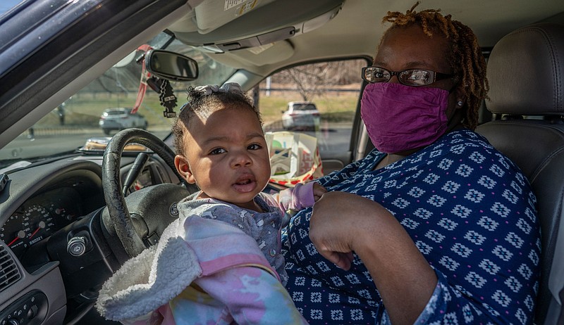 Jayne Greenlee and Skylar, 9 months, attend a community health event at Cathedral of Praise. (Photo: John Partipilo)