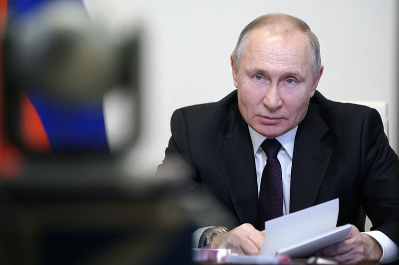 FILE - In this March 11, 2021, file photo, Russian President Vladimir Putin speaks during a meeting via video conference with officials and government cabinet members in Moscow, Russia. (Alexei Druzhinin, Sputnik, Kremlin Pool Photo via AP, File)



