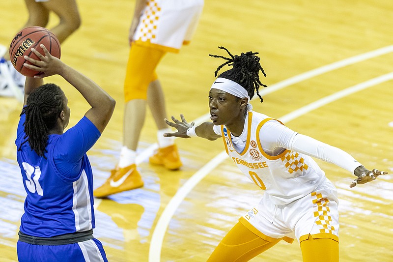 AP photo by Stephen Spillman / Tennessee's Rennia Davis, right, guards Middle Tennessee State's Deja Cage during the first half an NCAA tournament first-round game Sunday at the Frank Erwin Center in Austin, Texas. Davis had 24 points and 14 rebounds to help the third-seeded Lady Vols break out of a halftime tie and cruise to an 87-62 win.