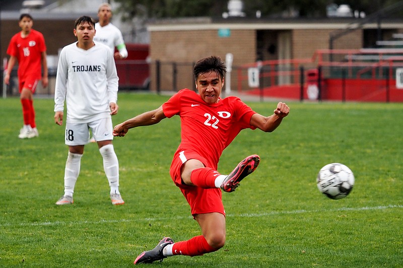 Staff photo by C.B. Schmelter / Dalton's Alejandro Martinez (22) plays the ball against Carrollton on Harmon Field at Bill Chappell Stadium on Tuesday, March 23, 2021 in Dalton, Ga.