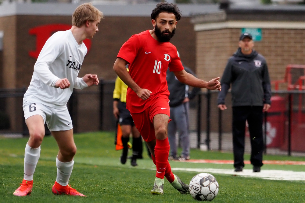 Staff photo by C.B. Schmelter / Carrollton's Austin Rader (6) defends against Dalton's Ivan Ceja (10) on Harmon Field at Bill Chappell Stadium on Tuesday, March 23, 2021 in Dalton, Ga.