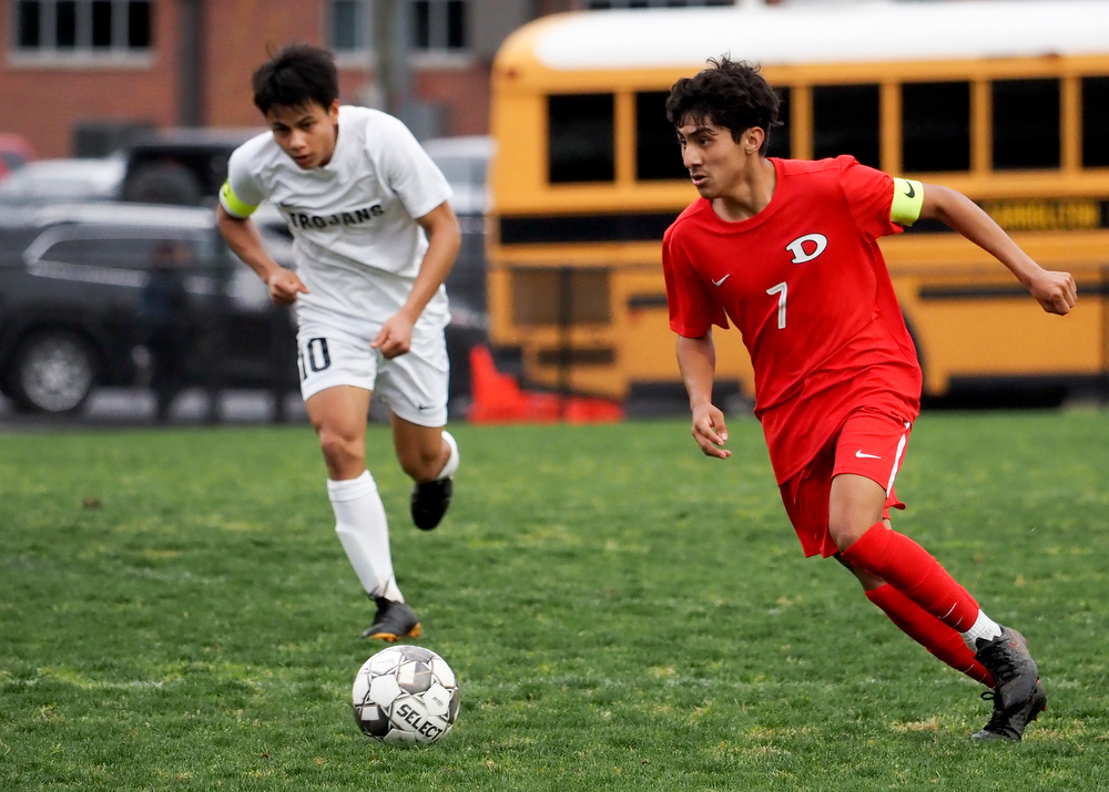 Staff photo by C.B. Schmelter / Dalton's Damian Rodriguez (7) plays the ball against Carrollton on Harmon Field at Bill Chappell Stadium on Tuesday, March 23, 2021 in Dalton, Ga.
