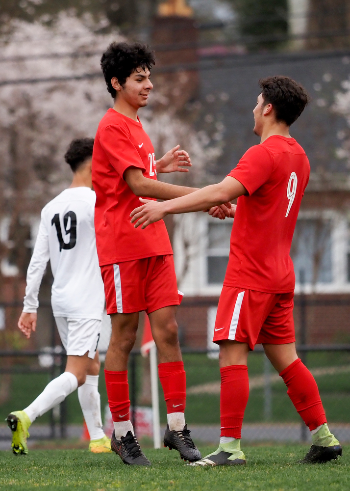 Staff photo by C.B. Schmelter / Dalton's Fabian Rodriguez (25) celebrates his goal with teammate Filemon Quintero (9) on Harmon Field at Bill Chappell Stadium on Tuesday, March 23, 2021 in Dalton, Ga.