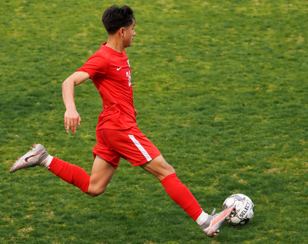 Staff photo by C.B. Schmelter / Dalton's Yahir Paez (26) plays the ball against Carrollton on Harmon Field at Bill Chappell Stadium on Tuesday, March 23, 2021 in Dalton, Ga.
