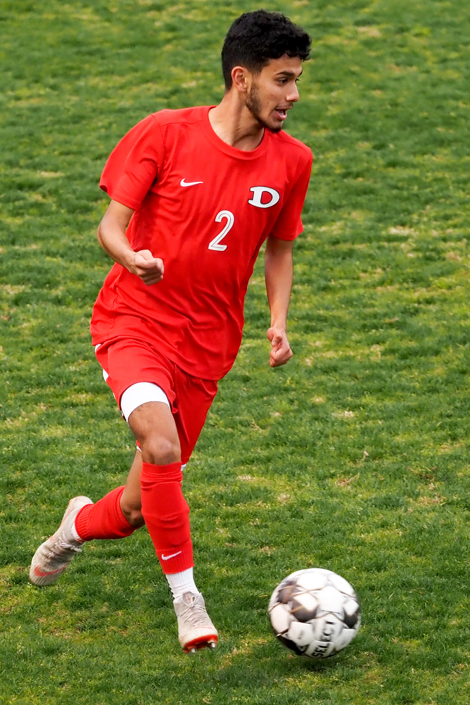 Staff photo by C.B. Schmelter / Dalton's Angel Salaises (2) plays the ball against Carrollton on Harmon Field at Bill Chappell Stadium on Tuesday, March 23, 2021 in Dalton, Ga.