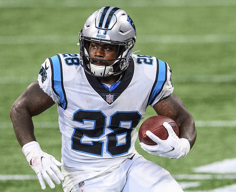 AP photo by Danny Karnik / Mike Davis carries the ball for the Carolina Panthers during an NFC South matchup with the Atlanta Falcons this past Oct. 11. Davis was a free agent this offseason and signed with the Falcons, his hometown team.