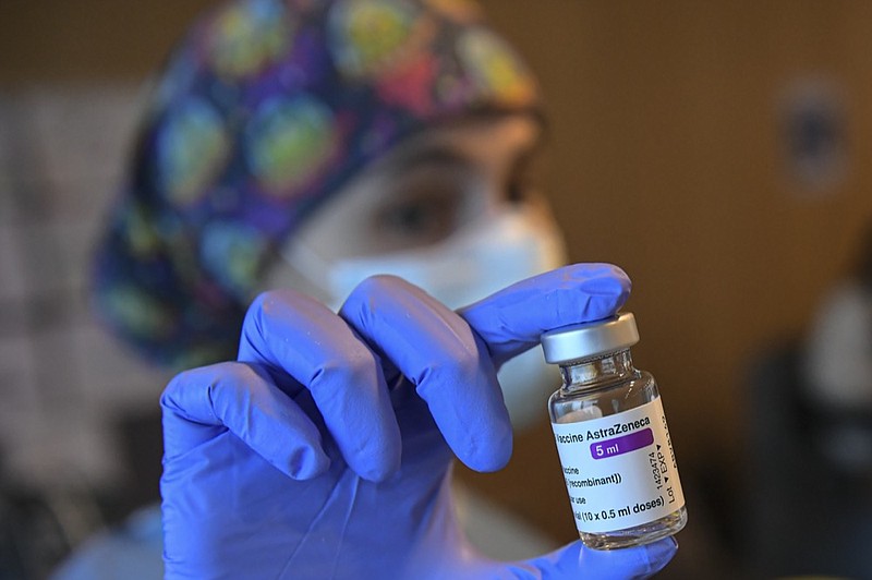 FILE - In this Wednesday, March 24, 2021, file photo, a health worker holds a dose of the AstraZeneca COVID-19 vaccine, during a mass vaccination campaign at San Pedro Hospital, in Logrono, northern Spain. (AP Photo/Alvaro Barrientos, File)


