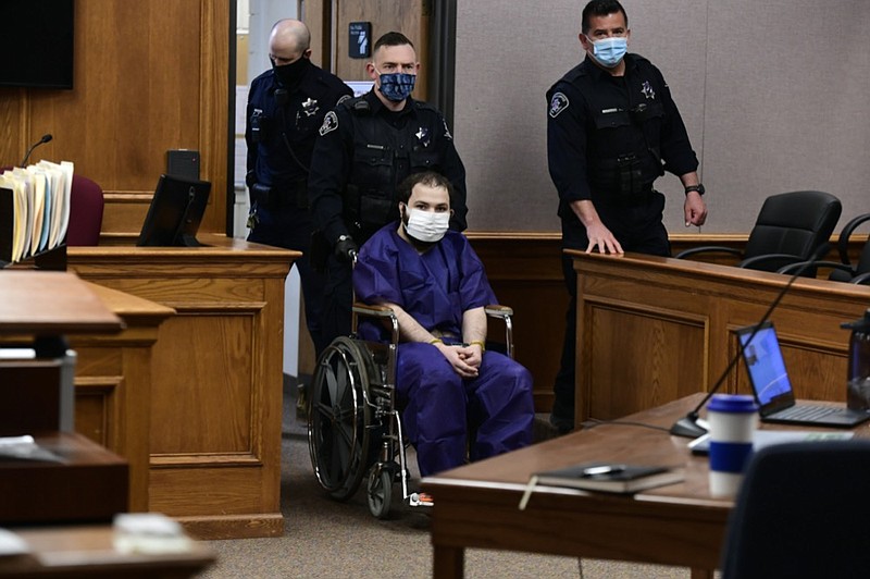 Ahmad Al Aliwi Alissa, 21, appears before Boulder District Court Judge Thomas Mulvahill at the Boulder County Justice Center in Boulder, Colo. on Thursday, March 25, 2021. Three days after he was led away in handcuffs from a Boulder supermarket where 10 people were fatally shot, Alissa appeared in court for the first time and his defense lawyer asked for a mental health assessment "to address his mental illness." (Helen H. Richardson/The Denver Post via AP, Pool)


