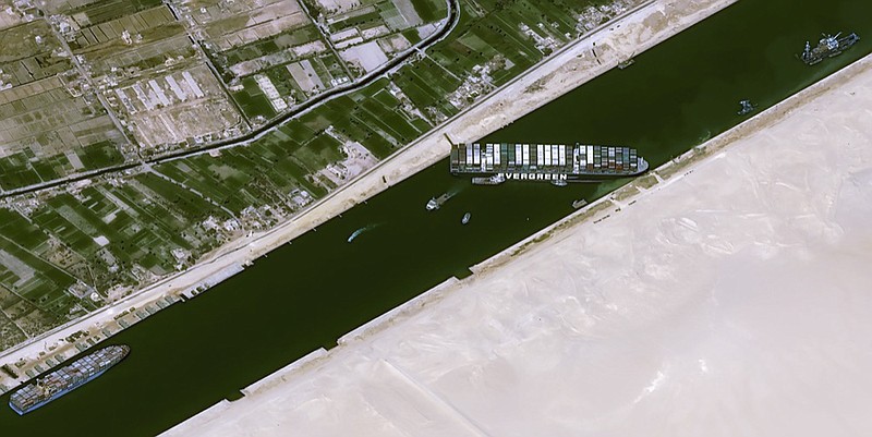 This satellite image from Cnes2021, Distribution Airbus DS, shows the cargo ship MV Ever Given stuck in the Suez Canal near Suez, Egypt, Thursday, March 25, 2021. (Cnes2021, Distribution Airbus DS via AP)


