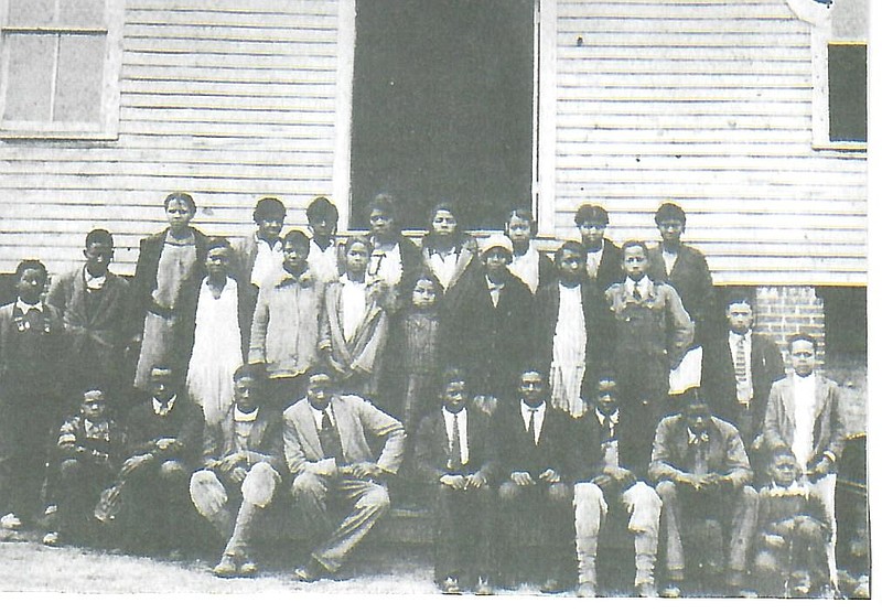 Contributed photo, courtesy of a donation to Walker County African American Historical and Alumni Association and Beverly C. Foster by Hubert Marsh / The North Georgia Baptist Industrial Institute on High Street in LaFayette, Ga., is shown in 1922. Ground was broken for the school, which was for first through ninth grades, in 1 916. In the far right of the top row is teacher and principal, Rosa Belle Glenn, later Rosa Belle Glenn-Clements, who later became principal of Wallaceville Elementary. The institute was organized by the African American North Georgia Baptist Association, which included churches from Walker, Dade, Catoosa and Chattooga counties. The Rev. George Washington Wheeler, once enslaved in Walker or Chattooga county, was the moderator (president) and founder of the association and organizer of many of the Baptist churches in those counties. He required each church in the association to send students to the Institute and help pay their tuition. The students were housed in local LaFayette community homes. After the ninth grade, students attended school in Chattanooga, Chattooga County and as far away as Gainesville, Ga. — wherever had an African American high school and their parents were able to afford the tuition.

