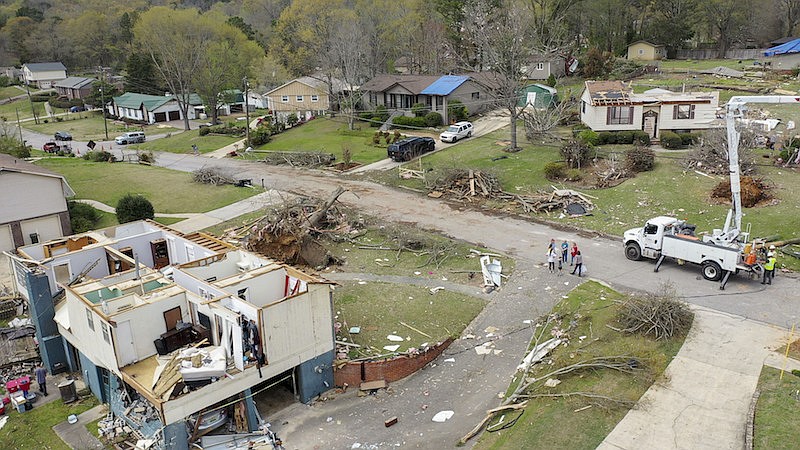 Drone images show the damaged to Trish Partridge's house at left and James Dunaway's home at right following a day of extended severe weather, Friday, March 26, 2021, in Pelham, Ala. (AP Photo/Vasha Hunt)