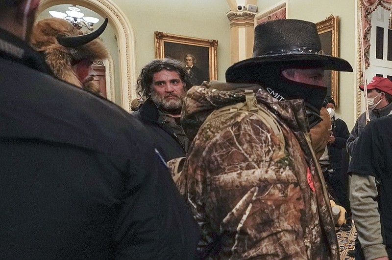 In this Jan. 6, 2021, photo, rioters, including Dominic Pezzola, center with beard, are confronted by U.S. Capitol Police officers outside the Senate Chamber inside the Capitol in Washington. (AP Photo/Manuel Balce Ceneta, File)


