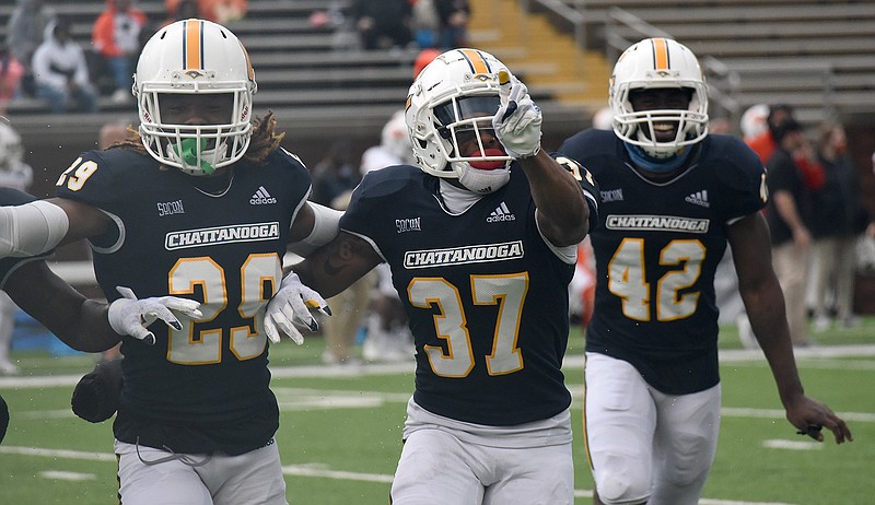 Staff photo by Matt Hamilton / UTC's Jelen Lee (37) celebrates after he intercepted a pass during Saturday's game against Mercer at Finley Stadium.