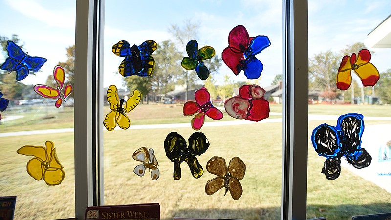 Staff Photo by Angela Lewis Foster | Butterflies fill the window in the art room Wednesday, October 26, 2015 at St. Nicholas School. The school will open a program for three-year-olds in August 2021.