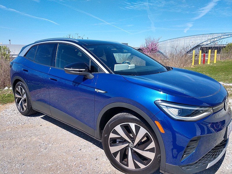 Staff photo by Mike Pare / A Volkswagen ID.4 SUV sits outside the company's Chattanooga production plant with part of the arched employee walkway in the background. The SUV is to be built in Chattanooga in 2022.