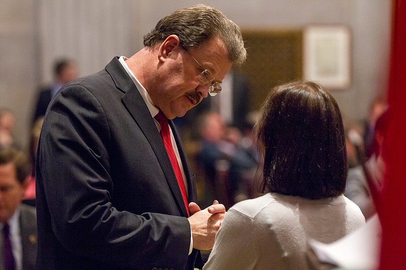 State Rep. Jerry Sexton, R-Bean Station, speaks with a colleague on the House floor in Nashville, Tenn., Wednesday, April 15, 2015. Sexton, a former pastor, is the sponsor of a bill seeking to make the Bible the official state book of Tennessee. (AP Photo/Erik Schelzig)